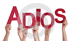 People Holding Spanish Word Adios Means Goodbye