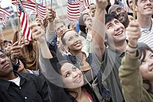 People Holding Up American Flags