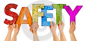 People holding up colorful rainbow wooden letter with words Safety isolated white background. security danger internet caution