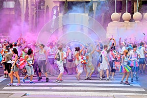 People at the Holi Color Run Party in the streets of the city