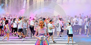 People at the Holi Color Run Party in the streets of the city