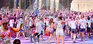 People at the Holi Color Run Party in the streets of the city