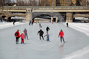 People ice skating on the Rideau Canal, Ottawa for Winterlude.