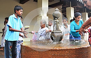 People inside the Temple of the Tooth