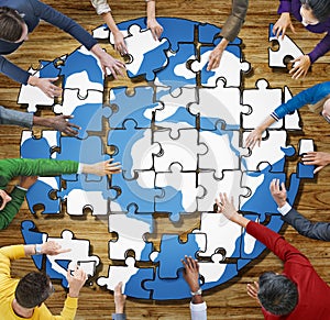 People with Jigsaw Puzzle Forming Globe Photo and Illustration