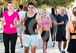 People jogging on city seafront