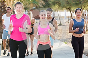 People jogging on city seafront