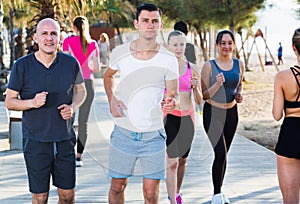 People jogging on city seafront