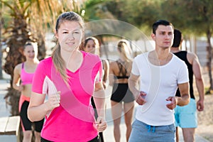 People jogging on city seafront