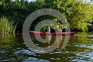 People on kayak outing rafting down the river