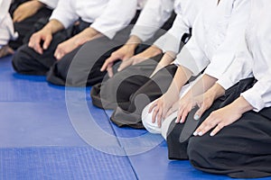 People in kimono and hakama on martial arts training seminar