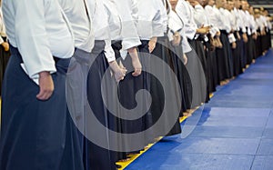 People in kimono and hakama standing in a long