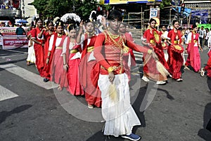 The people of Kolkata celebrating with colorful traditional dress in the ity street.