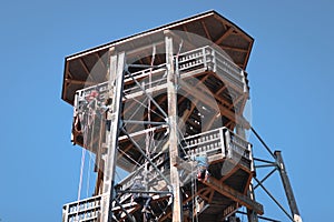 People learining safely the technic of climbing on a wooden building. saftey, worker, danger, climbing, fun, tourist, equipment;