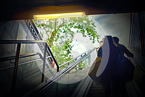 People lift on the escalator of the subway, blurred image