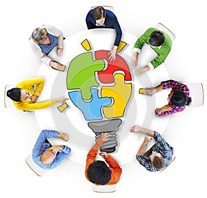 People with Light Bulb Jigsaw Puzzle Forming