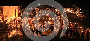 People with light and candles in the night.