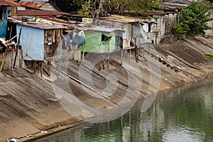 People living in poverty along the canals of Manila Philippines