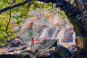 People are looking at beautiful waterfalls in nature