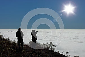 People looking for clouds sky and sun