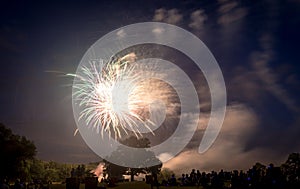 People looking at fireworks in honor of Independence Day