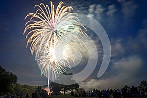 People looking at fireworks in honor of Independence Day