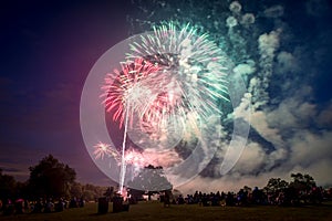 People looking at fireworks in honor of Independence Day