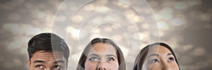 People looking up with sparkling background