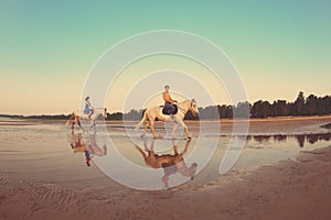 People in love at sunset in the sea