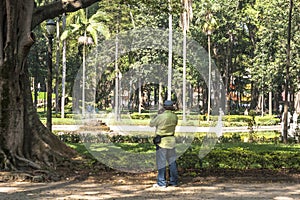 People on Luz Public Park in downtowns Sao Paulo. This is the city's first public park