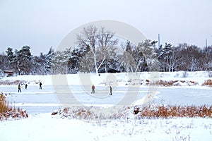 People make ice playground for skating and hockey photo