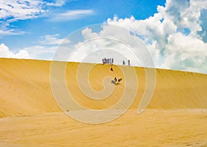 People Making Sandboarding at Dune Jericoacoara Brazil