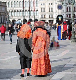 People masked during the Carnival party in Piazza San Marco in V