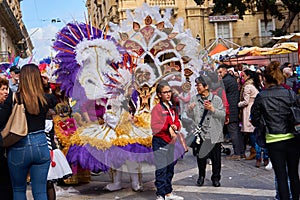 Annual Mardi Gras Fat Tuesday grand parade on maltese street of allegorical floats and masquerader procession