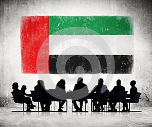 People in a Meeting with United Arab Emirates Flag