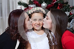 People, motherhood, family, christmas and adoption concept - happy mother and daughter hugging at home