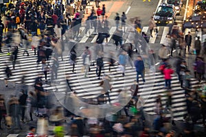 People in motion blur crossing street in Shibuya photo