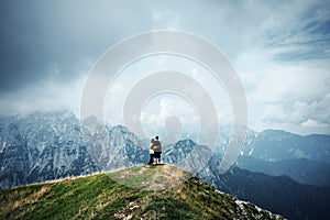 People in mountains, background alps