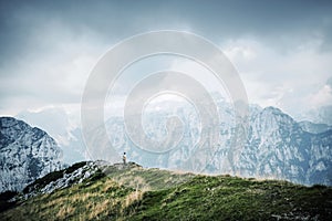 People in mountains, background alps