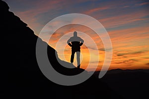 People in mountains and beautiful sunrise scene