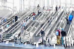 People on moving escalator motion blur