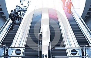 People moving in escalator