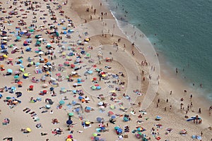 People at NazarÃ© Beach, Portugal photo