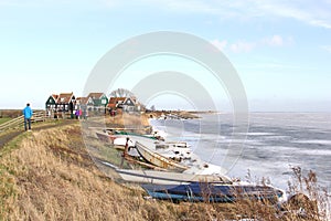 People near the village Marken along a frozen Markermeer in the Netherlands