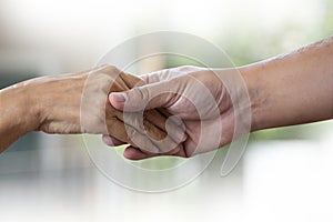 People old woman  and young hand holding Disabled walking with assistance