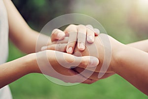 people old and young hand holding with sunlight. concept power of hope