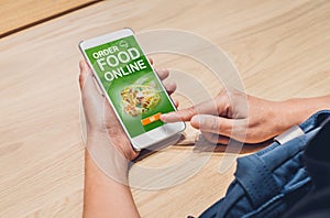 People order food online with mobile apps on wood table at home,online food delivery technology in daily lifestyle,Digital age co