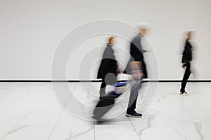 People out of focus at the airport