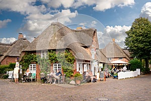 People on outdoor cafe terrace, Nieblum, Foehr island, North Frisia, Schleswig-Holstein, Germany