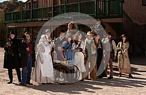 People outside a building in old west costumes